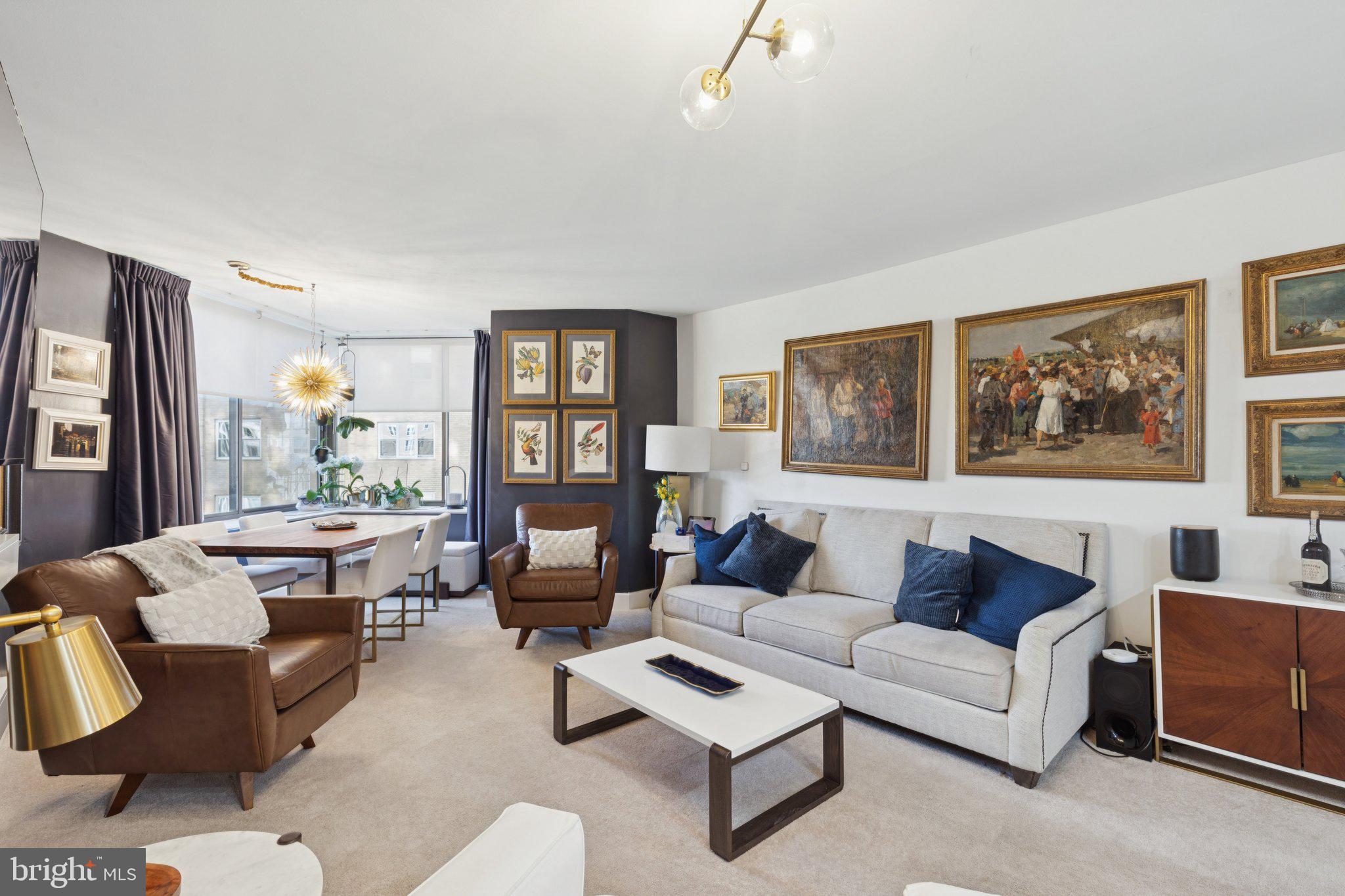 202 West Rittenhouse Square, Unit 1409 Philadelphia, PA 19103 - Photo 2 of 39 a living room with furniture and a large window