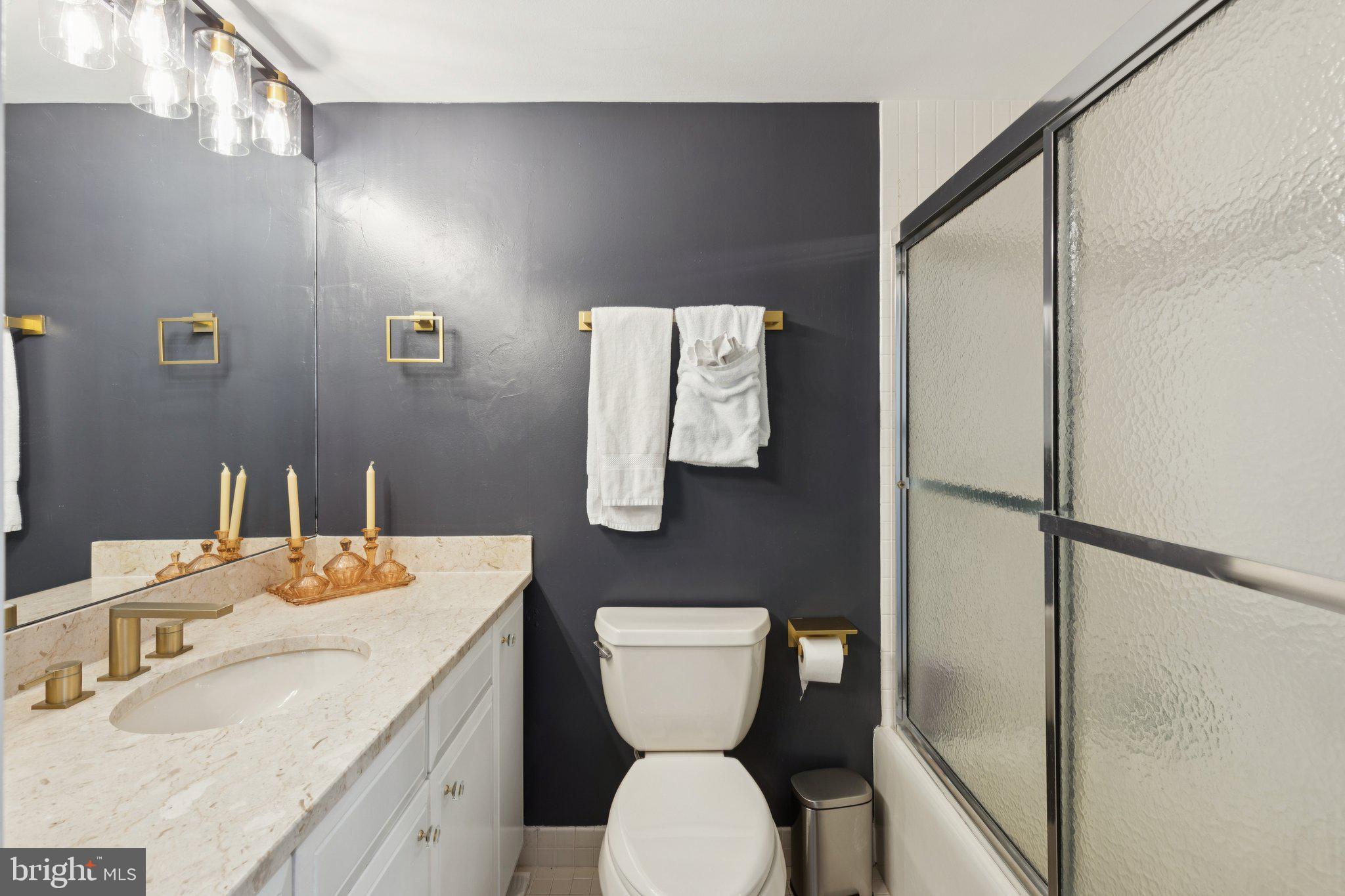 202 West Rittenhouse Square, Unit 1409 Philadelphia, PA 19103 - Photo 22 of 39 a bathroom with a toilet a sink and mirror
