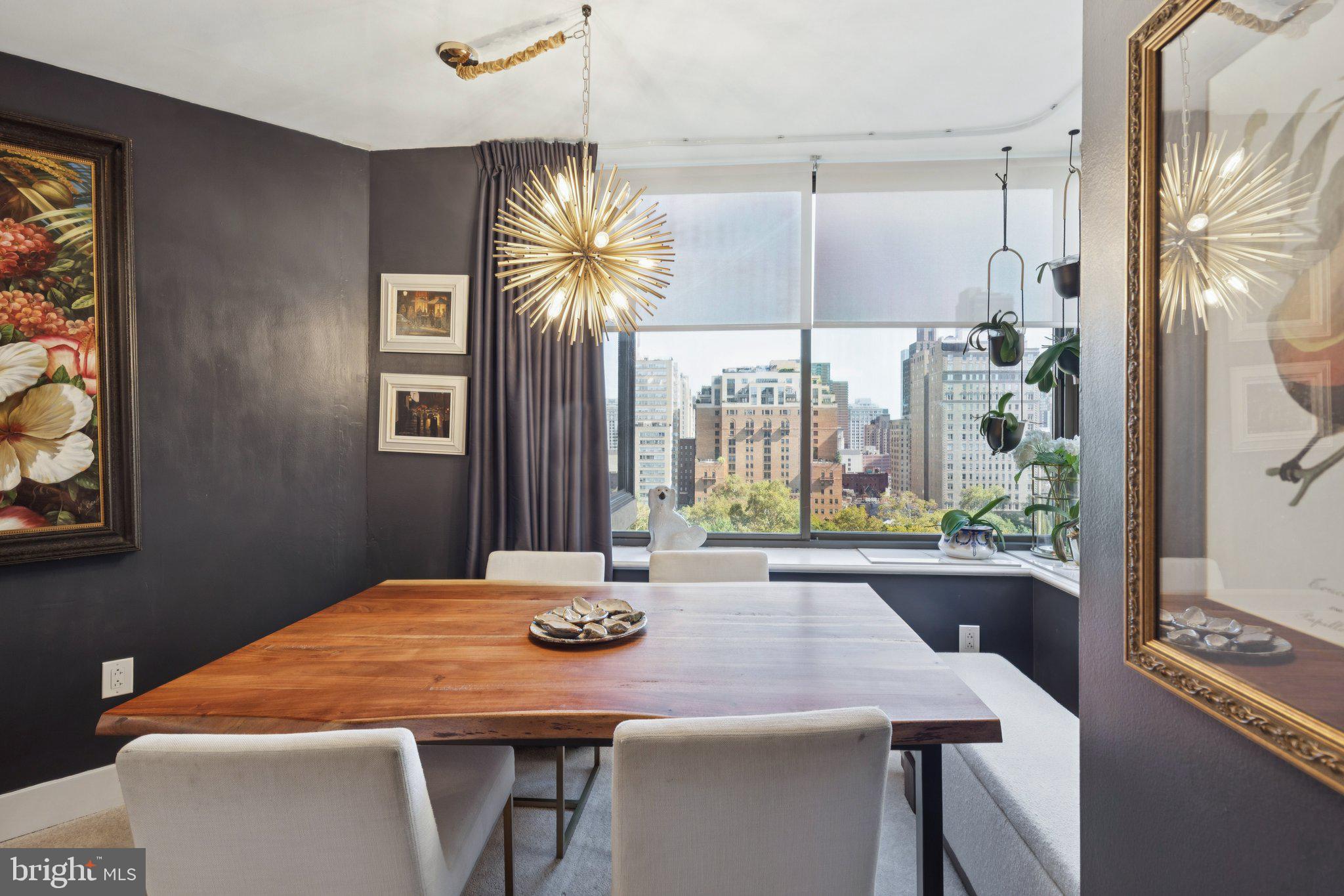 202 West Rittenhouse Square, Unit 1409 Philadelphia, PA 19103 - Photo 5 of 39 a dining room with a table and chairs