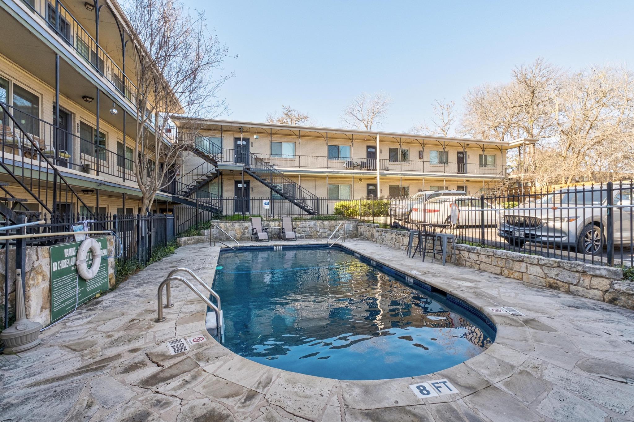 1202 Newning Avenue, Unit 207 Austin, TX 78704 - Photo 16 of 17 an aerial view of a house with swimming pool