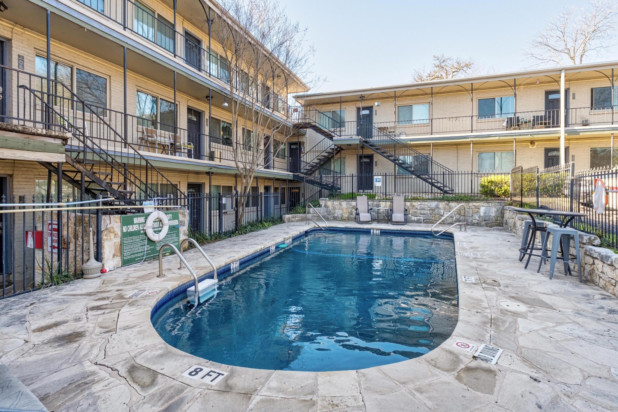 1202 Newning Avenue, Unit 207 Austin, TX 78704 - Photo 17 of 17 a view of a swimming pool with sitting area