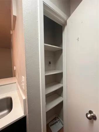 a bathroom with a double vanity sink and a toilet