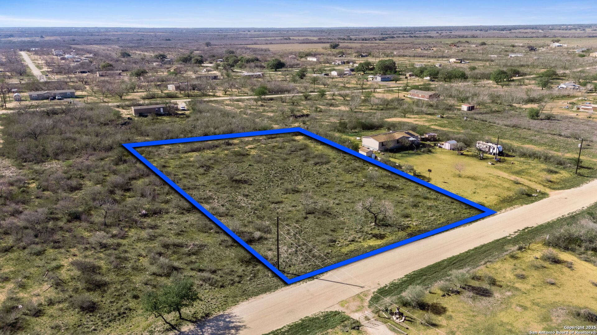 167 County Road 2665 Devine, TX 78016 - Photo 4 of 7 a view of a pool with a lake and mountain view