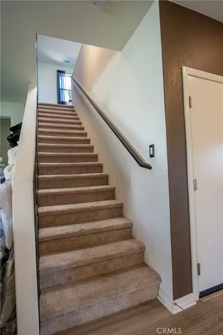 a bathroom with a granite countertop sink a mirror and a shower