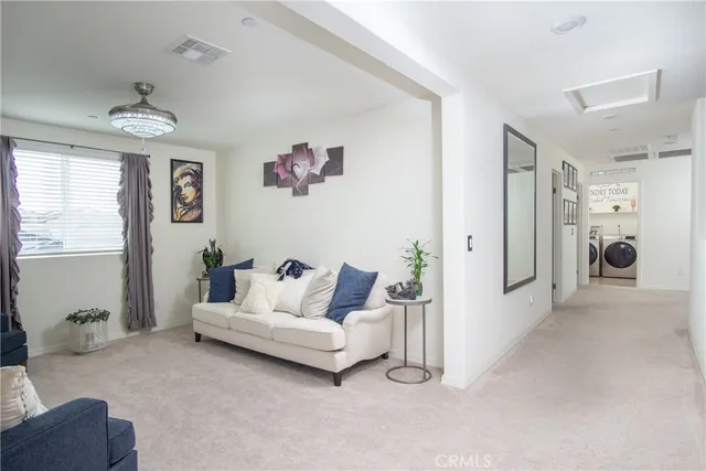 a bedroom with a bed and a television