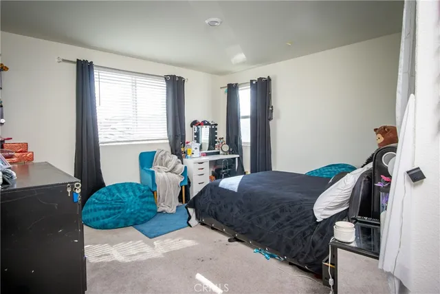 a view of a porch with furniture and garden