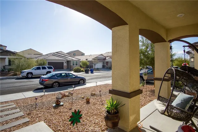 a view of a dining room with furniture and a potted plant