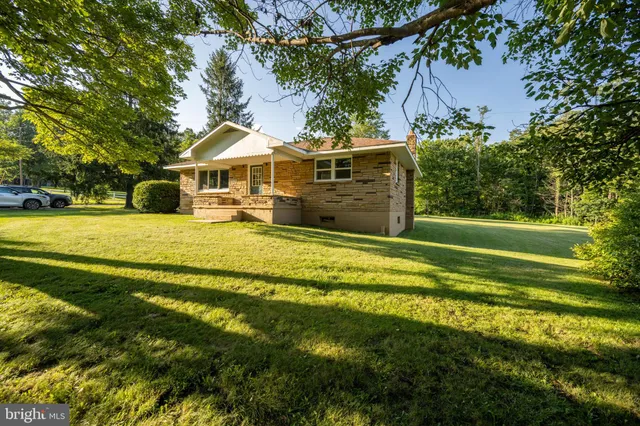 a view of a house with a big yard