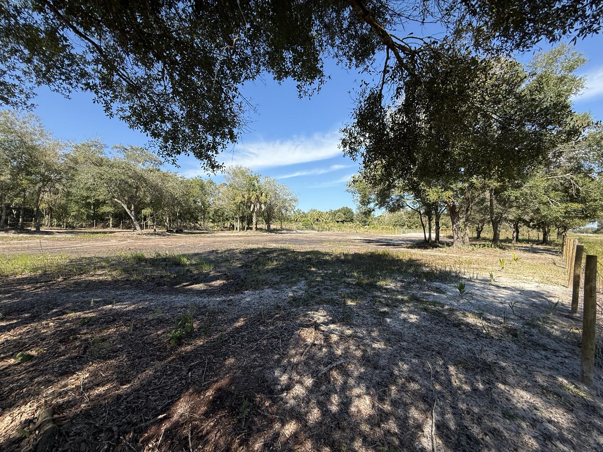 17618 Northwest 286th Street Okeechobee, FL 34972 - Photo 7 of 17 a view of dirt yard with green space