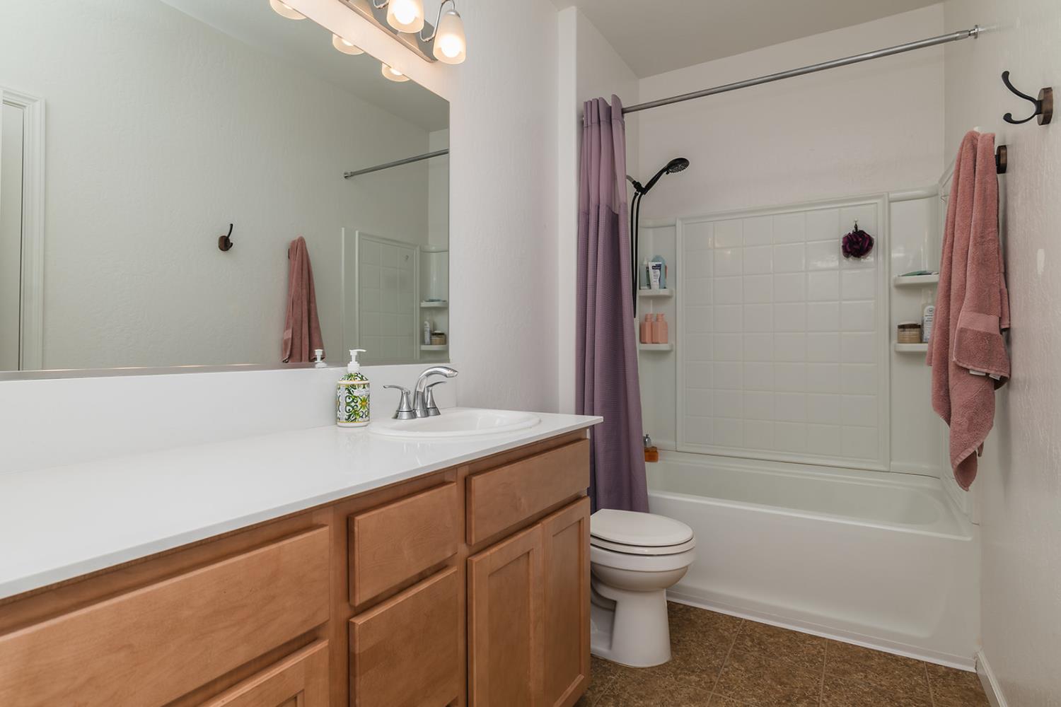 1945 East Gum Avenue Reedley, CA 93654 - Photo 26 of 31 a bathroom with a sink toilet and shower