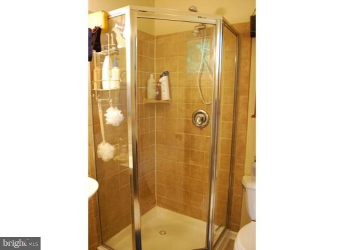 5529 Callander Drive Springfield, VA 22151 - Photo 11 of 30 a bathroom with a shower and a mirror