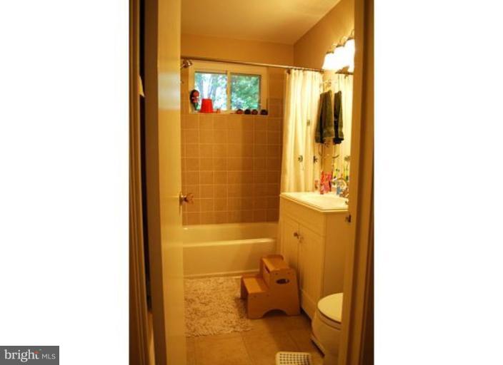 5529 Callander Drive Springfield, VA 22151 - Photo 13 of 30 a bathroom with a sink and a mirror