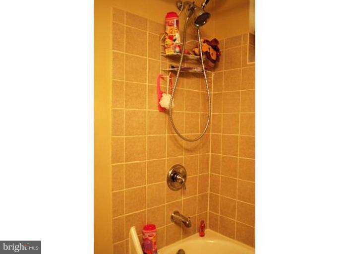 5529 Callander Drive Springfield, VA 22151 - Photo 14 of 30 a bathroom with a shower