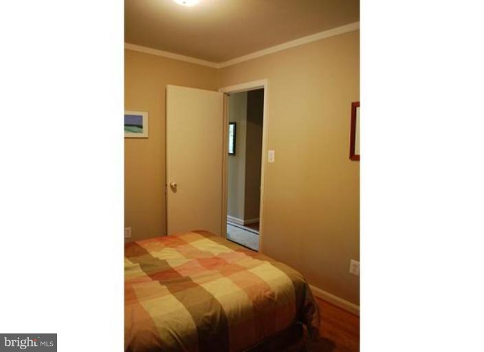 5529 Callander Drive Springfield, VA 22151 - Photo 16 of 30 a bedroom with a bed and a mirror
