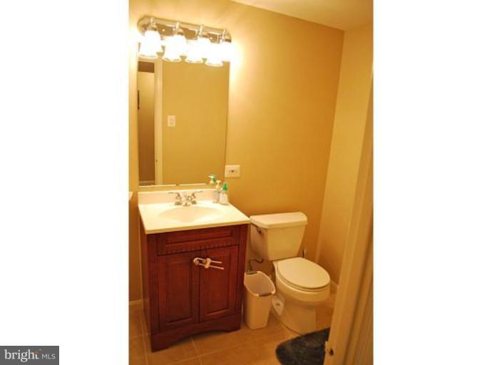 5529 Callander Drive Springfield, VA 22151 - Photo 28 of 30 a bathroom with a toilet a sink and mirror
