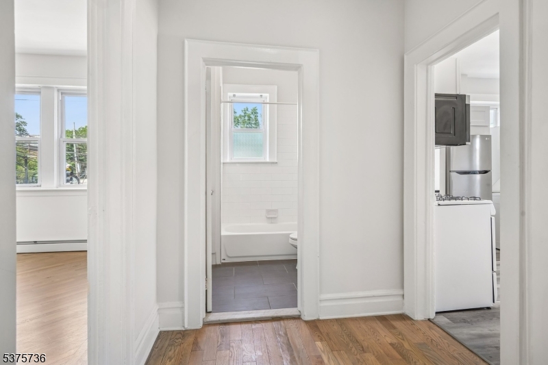34 Main Street Millburn, NJ 07041 - Photo 11 of 23 a view of a bathroom from the hallway