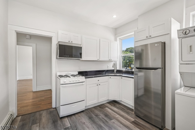 34 Main Street Millburn, NJ 07041 - Photo 12 of 23 a kitchen with a refrigerator stove and microwave