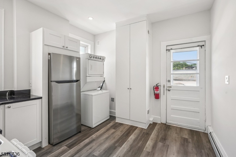 34 Main Street Millburn, NJ 07041 - Photo 14 of 23 a kitchen with a refrigerator and cabinets
