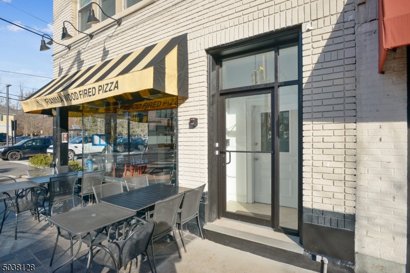 34 Main Street Millburn, NJ 07041 - Photo 2 of 23 a view of a dinning table and chairs in the balcony