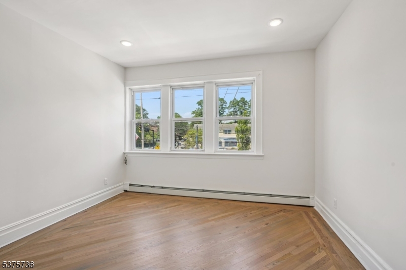 34 Main Street Millburn, NJ 07041 - Photo 5 of 23 an empty room with a window