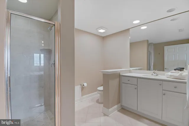 a bathroom with a double vanity sink and mirror
