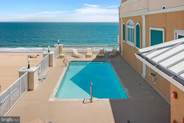 a view of a balcony with ocean view