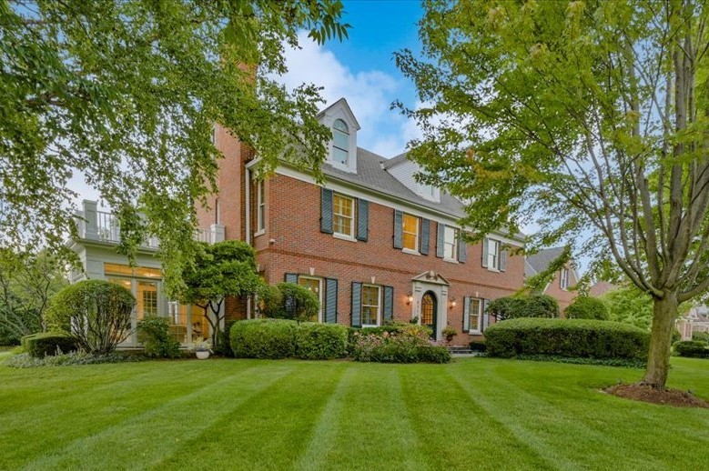 8010 Greenbriar Court Burr Ridge, IL 60527 - Photo 1 of 57 a front view of a house with a garden