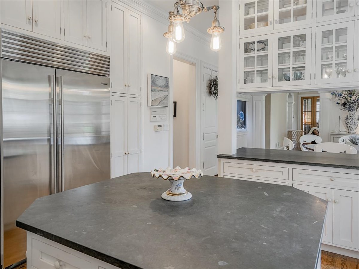 8010 Greenbriar Court Burr Ridge, IL 60527 - Photo 11 of 57 a kitchen with stainless steel appliances granite countertop a sink and a refrigerator
