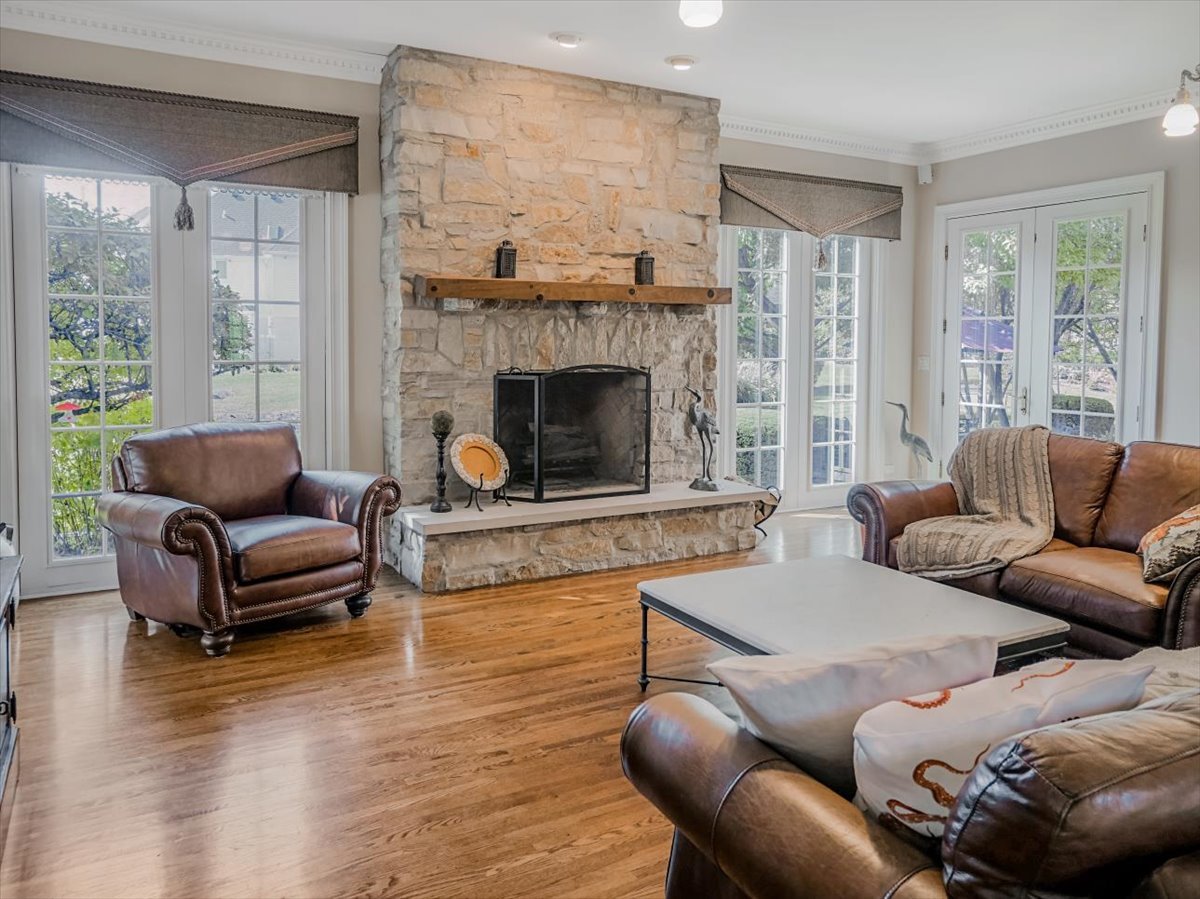 8010 Greenbriar Court Burr Ridge, IL 60527 - Photo 12 of 57 a living room with furniture and a fireplace