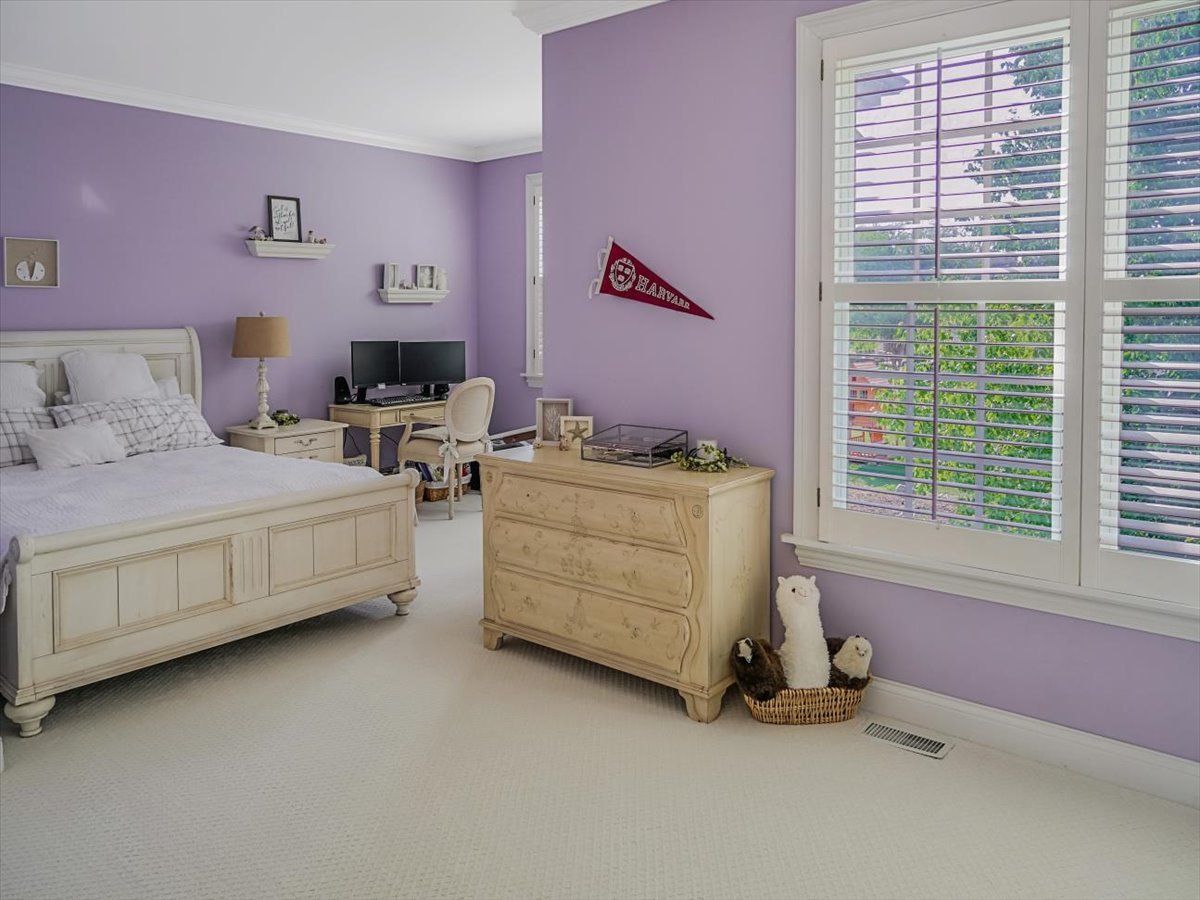8010 Greenbriar Court Burr Ridge, IL 60527 - Photo 22 of 57 a bedroom with bed and a window
