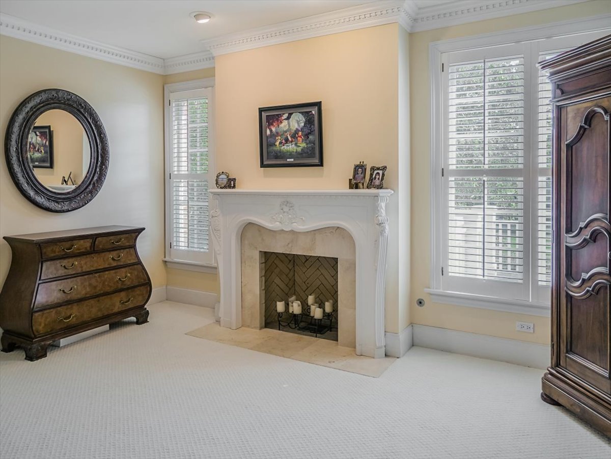 8010 Greenbriar Court Burr Ridge, IL 60527 - Photo 26 of 57 a living room with furniture and a fireplace