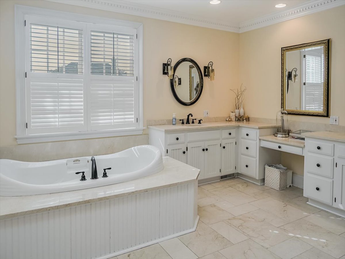 8010 Greenbriar Court Burr Ridge, IL 60527 - Photo 28 of 57 a bathroom with a sink and a mirror