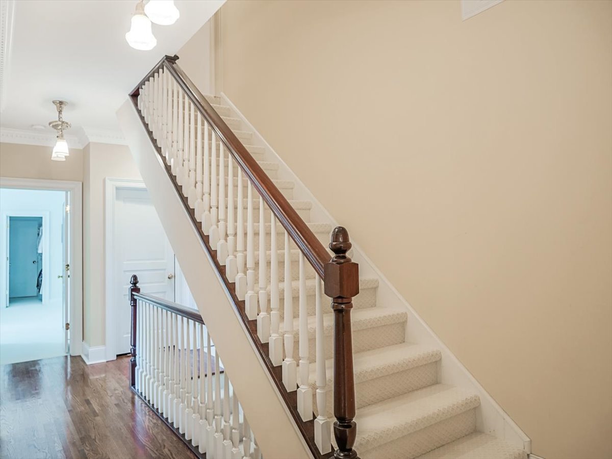 8010 Greenbriar Court Burr Ridge, IL 60527 - Photo 30 of 57 a view of staircase with wooden floor and white walls