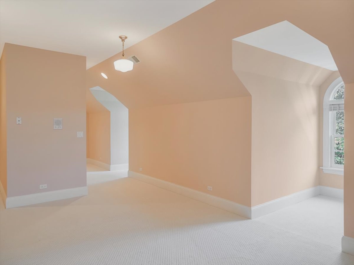 8010 Greenbriar Court Burr Ridge, IL 60527 - Photo 32 of 57 a view of an empty room with wooden floor