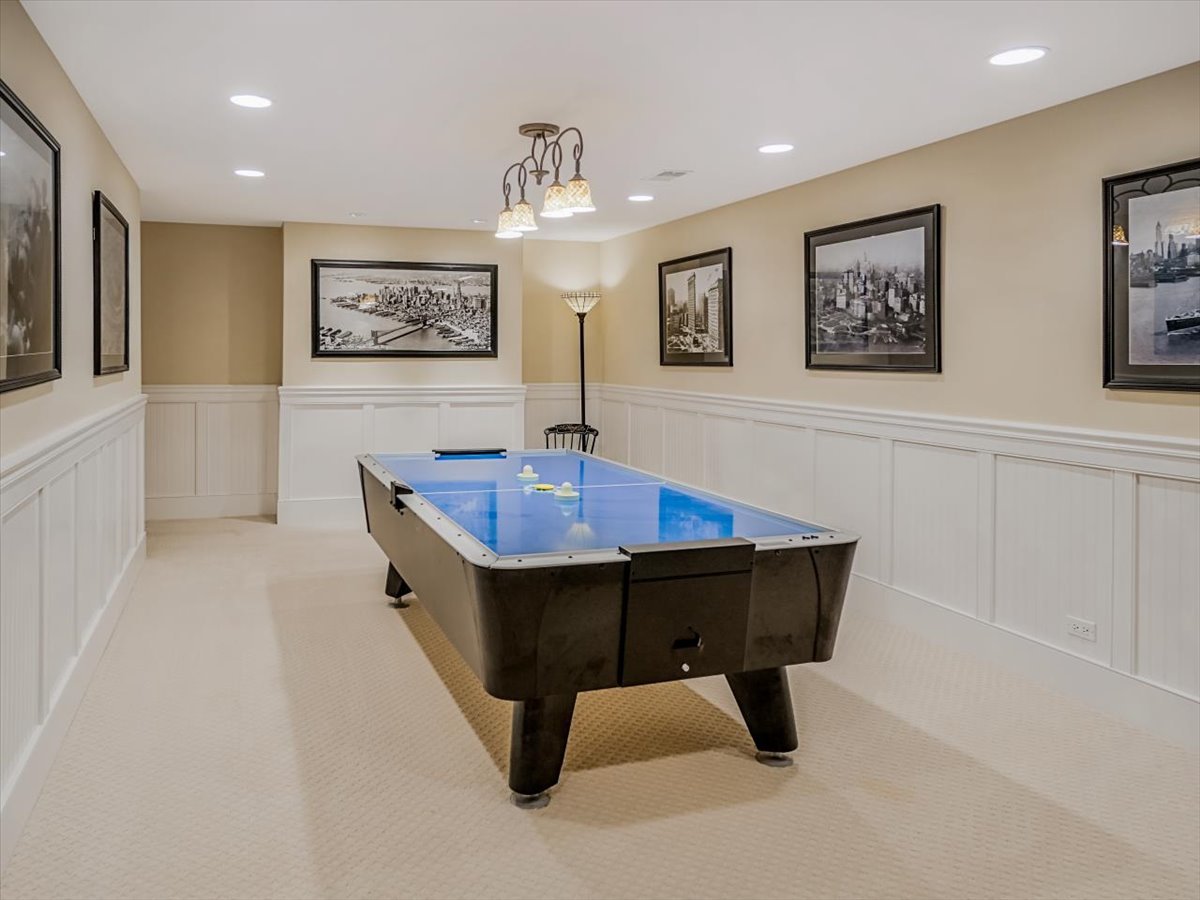 8010 Greenbriar Court Burr Ridge, IL 60527 - Photo 40 of 57 a living room with table chairs and wooden floor