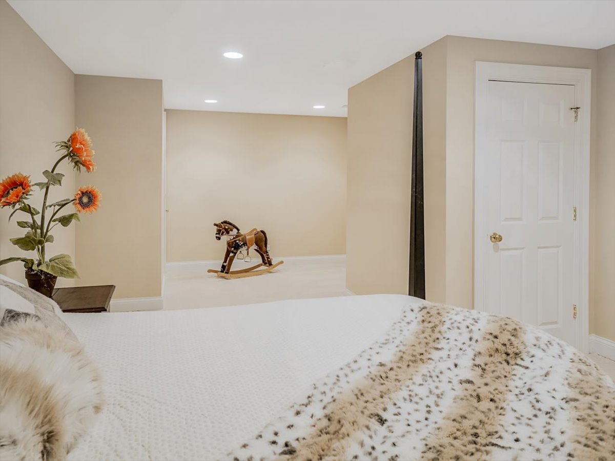 8010 Greenbriar Court Burr Ridge, IL 60527 - Photo 44 of 57 a bedroom with a bed and a dresser