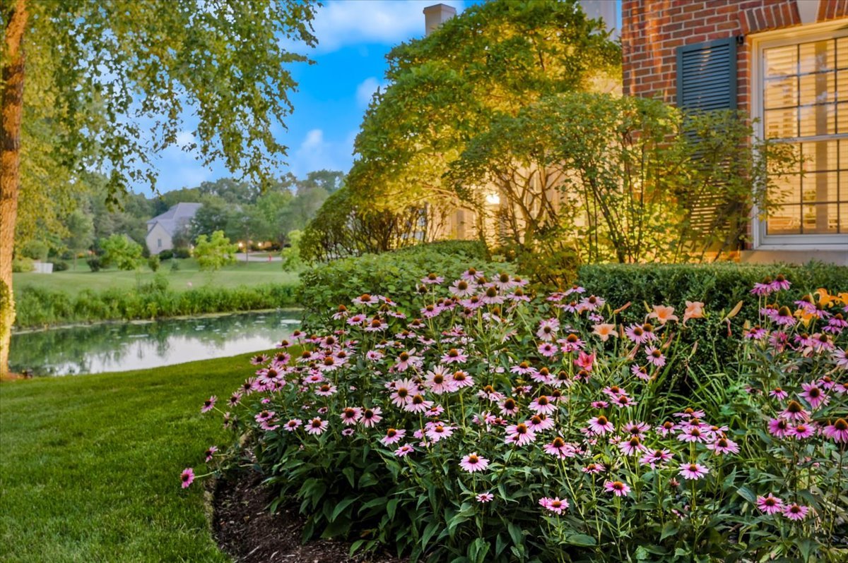 8010 Greenbriar Court Burr Ridge, IL 60527 - Photo 53 of 57 a view of a lake with a flower garden