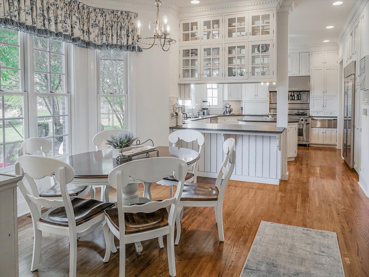 8010 Greenbriar Court Burr Ridge, IL 60527 - Photo 7 of 57 a view of a dining room with furniture window and wooden floor
