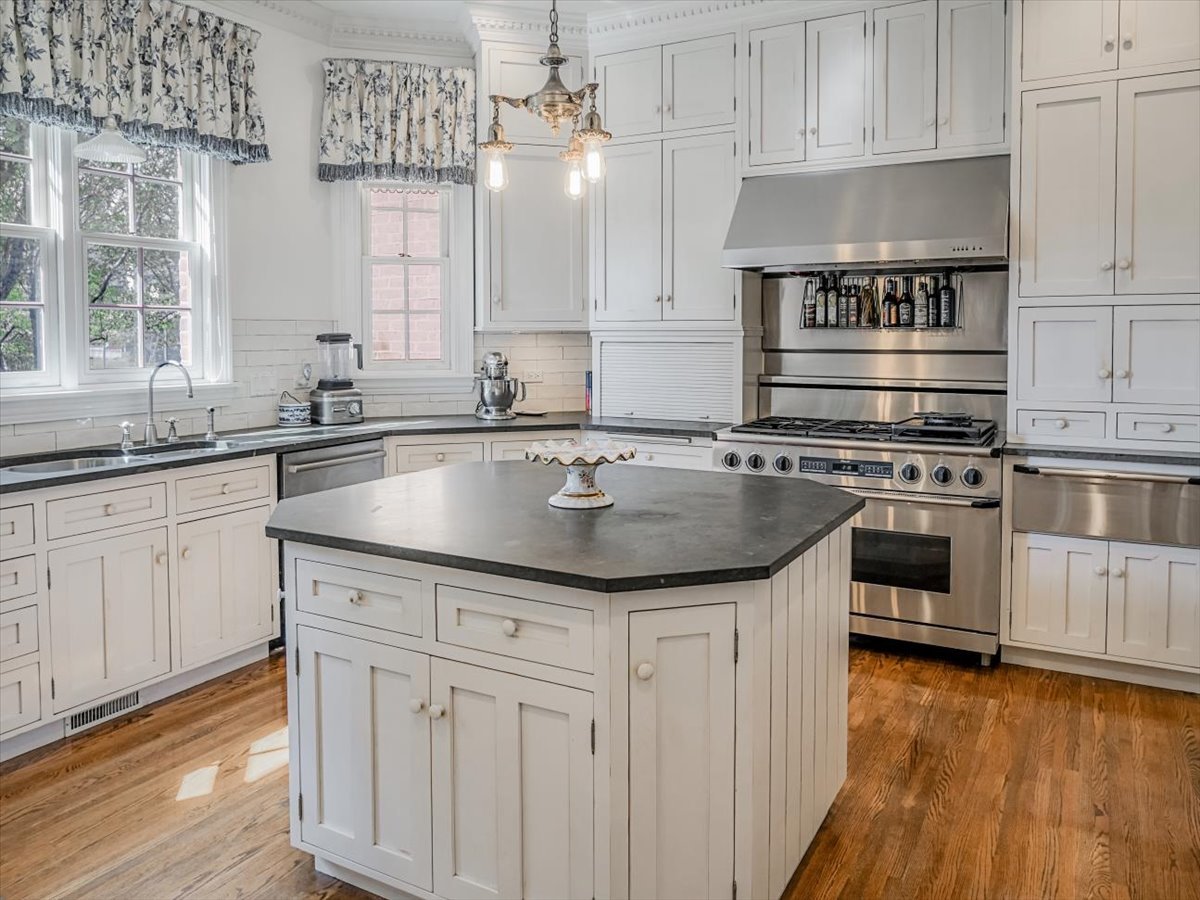 8010 Greenbriar Court Burr Ridge, IL 60527 - Photo 10 of 57 a kitchen with granite countertop a sink a counter space appliances and cabinets