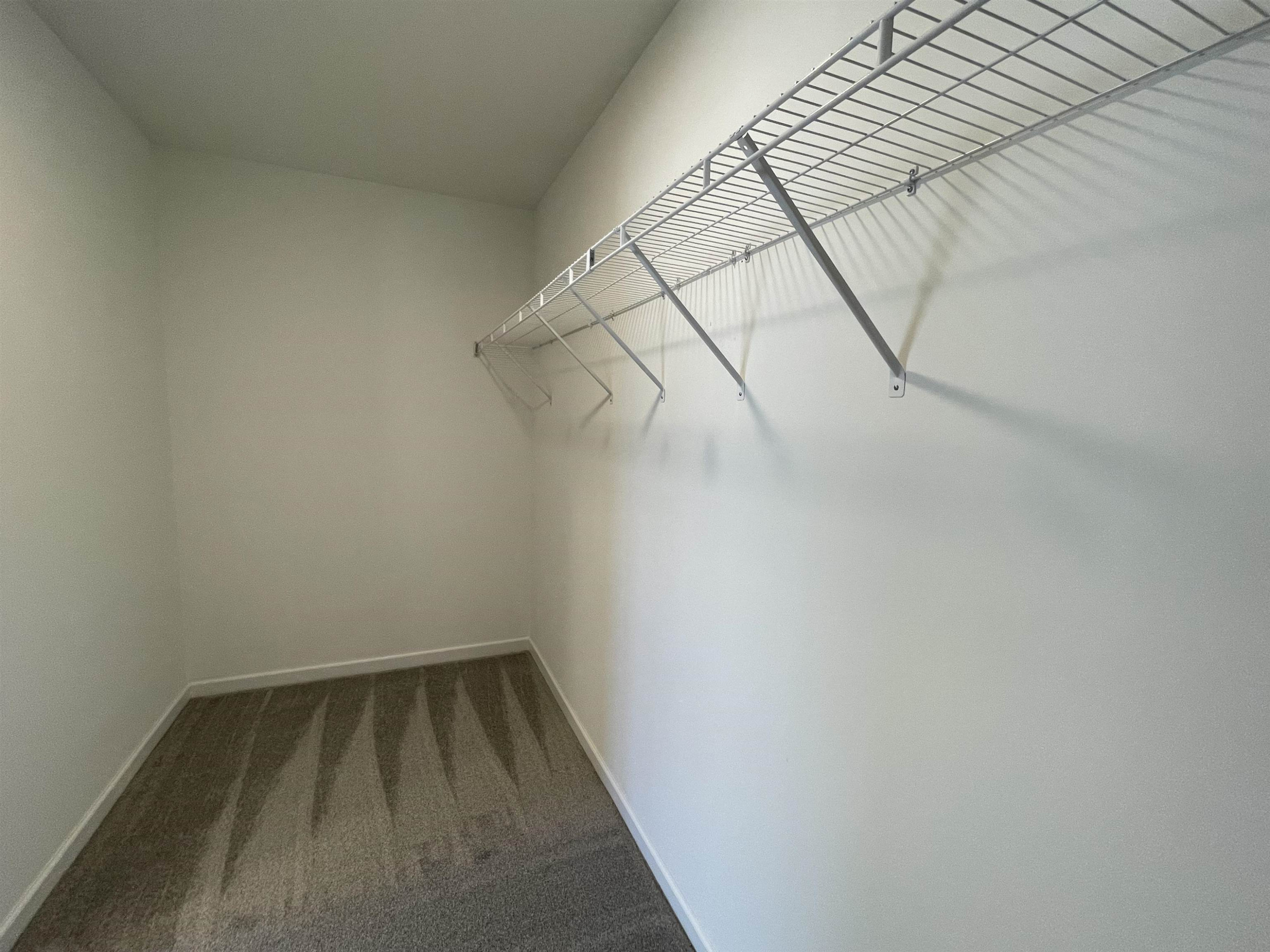 394 Touchdown Way Benson, NC 27504 - Photo 13 of 20 a view of a room with racks on the wall