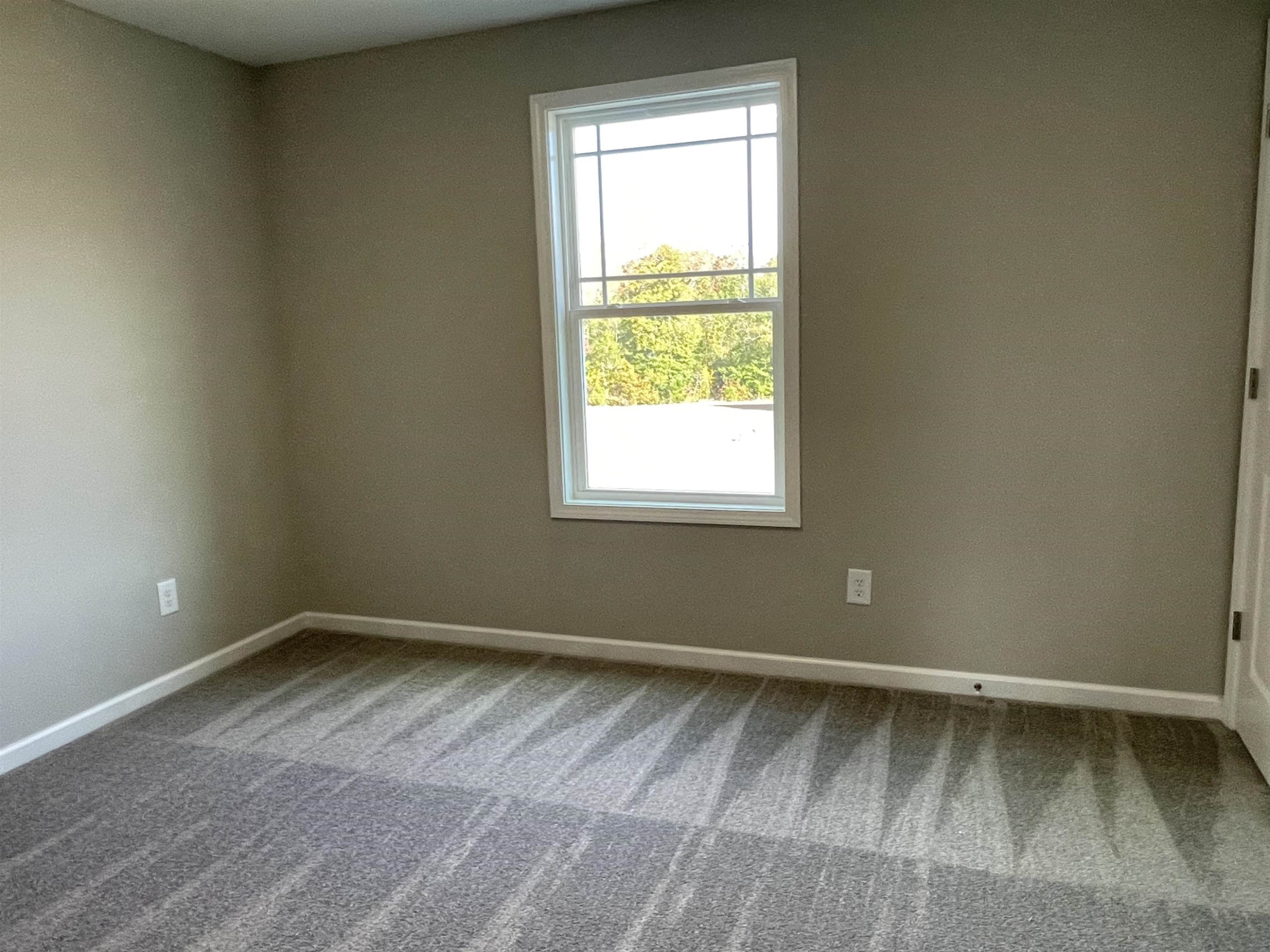 394 Touchdown Way Benson, NC 27504 - Photo 16 of 20 an empty room with a window