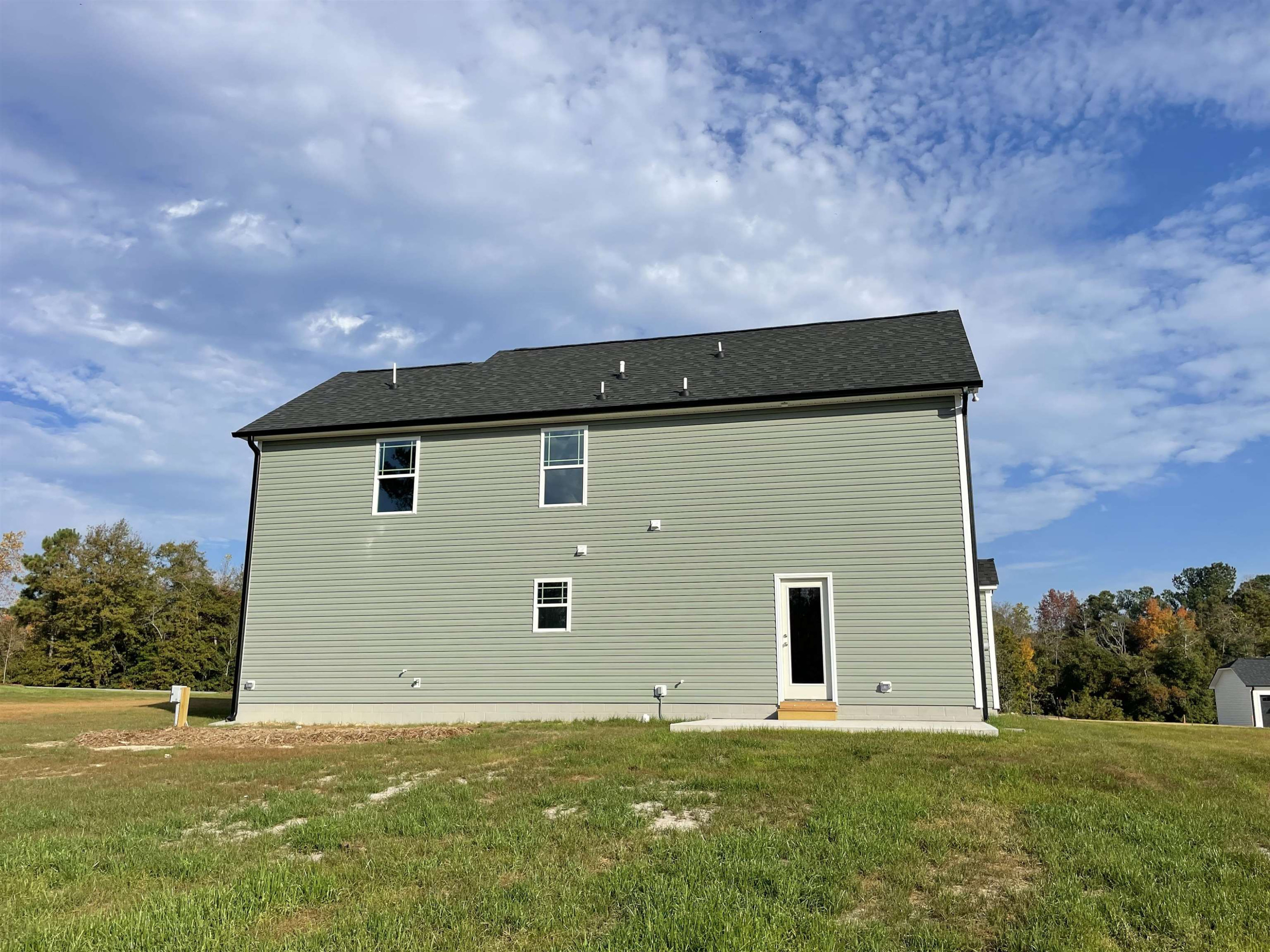 394 Touchdown Way Benson, NC 27504 - Photo 19 of 20 a house with a yard