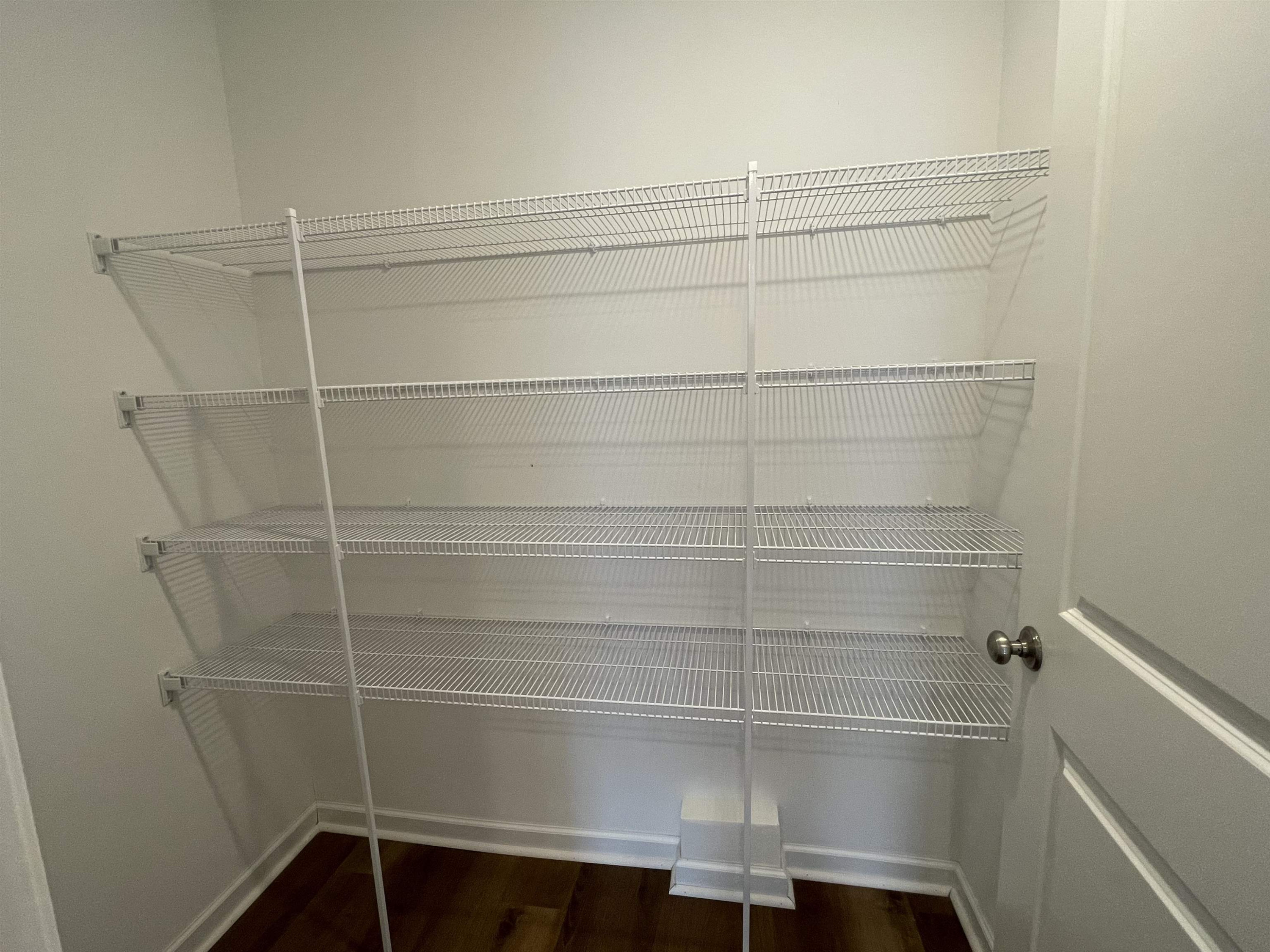 394 Touchdown Way Benson, NC 27504 - Photo 7 of 20 a view of a room with racks on the wall