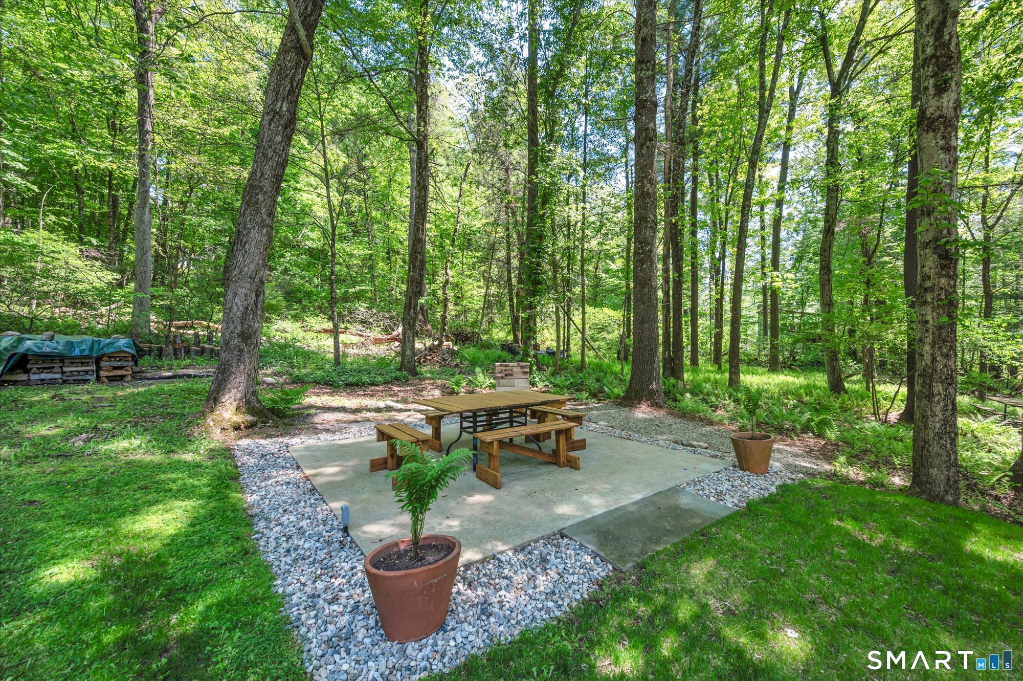 59 Indian Hill Road Canton, CT 06019 - Photo 29 of 39 a garden view with a seating space