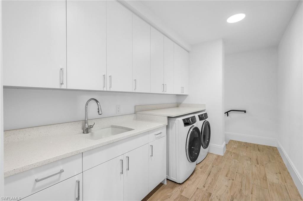 1130 3rd Avenue South, Unit 115 Naples, FL 34102 - Photo 15 of 28 a utility room with sink dryer and washer