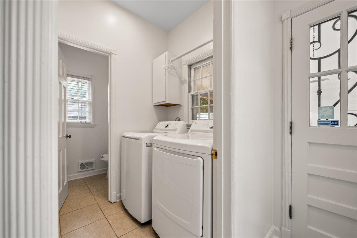 1273 Brookfield Road Memphis, TN 38119 - Photo 19 of 40 Dedicated laundry area featuring tile flooring, white cabinetry, and a window with blinds