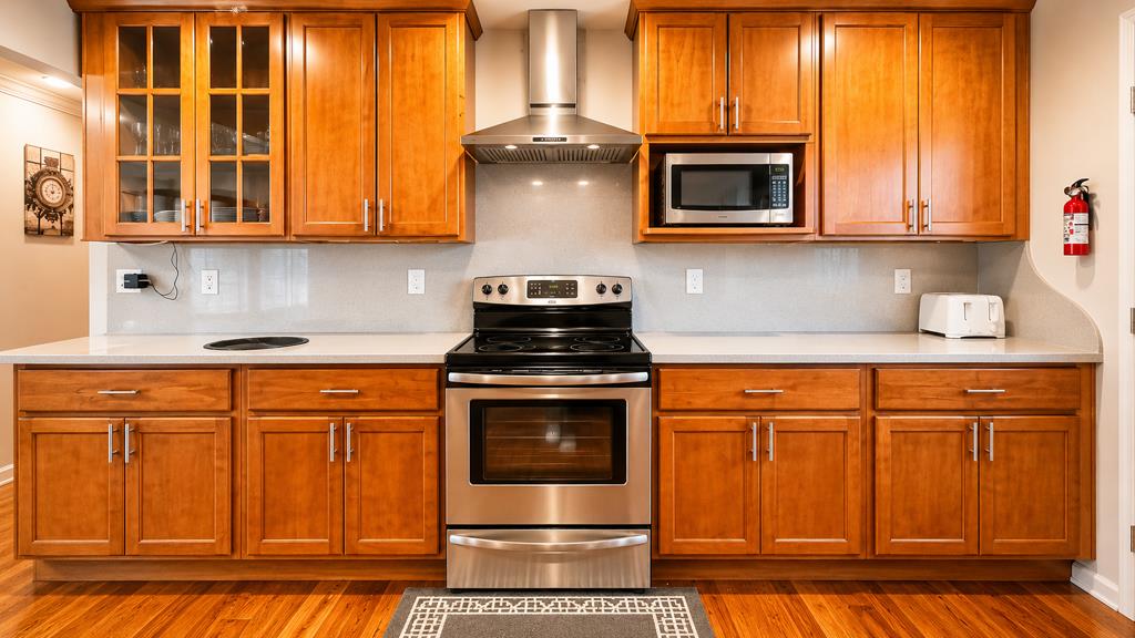 1281 Traynor Road Concord, CA 94520 - Photo 14 of 41 a kitchen with stainless steel appliances granite countertop a stove a microwave and cabinets