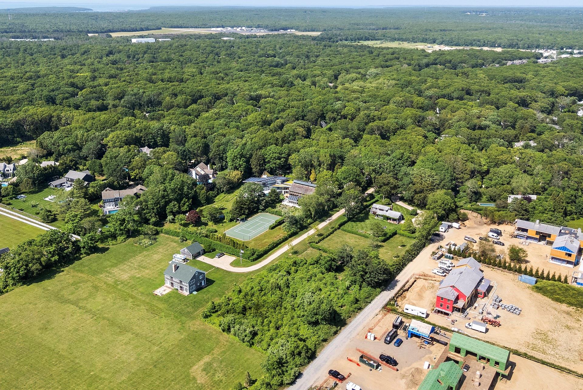48 Sayre's Path Wainscott, NY 11975 - Photo 4 of 12 Drone / aerial view of a heavily wooded area