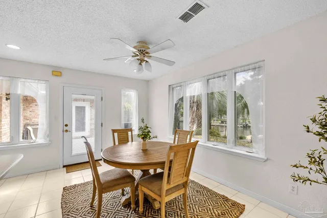a view of a dining room with furniture and window