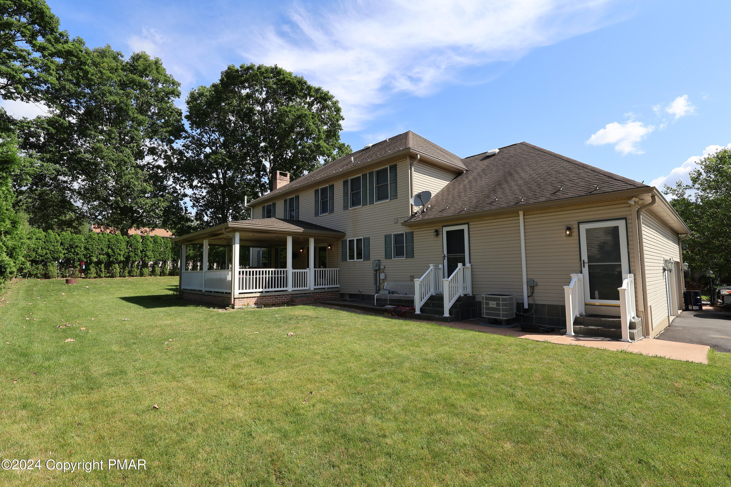 1179 Dotta Drive Pen Argyl, PA 18072 - Photo 2 of 39 a front view of a house with a garden and yard
